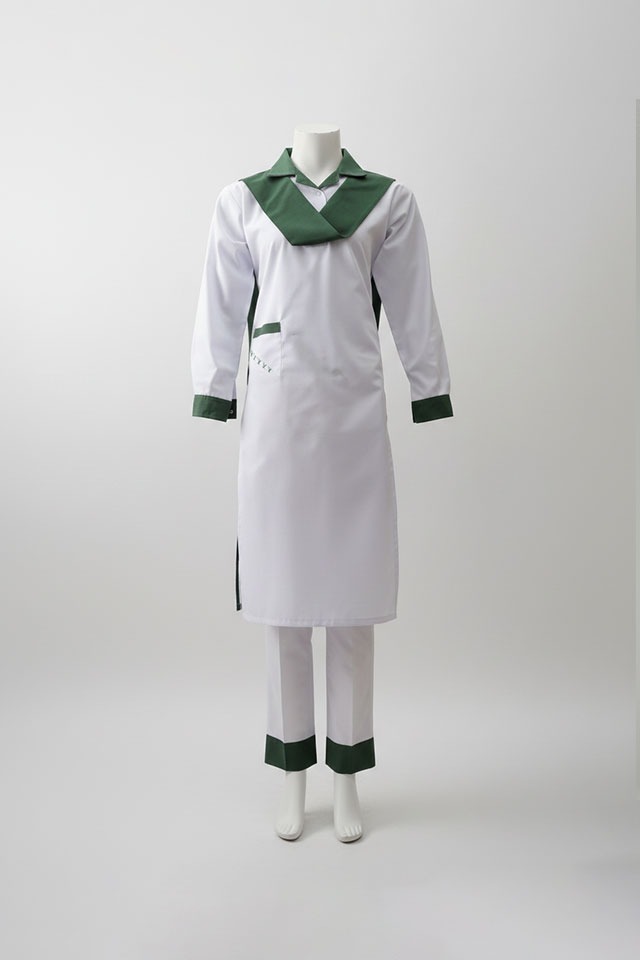 White school uniform with green trim long tunic and pants
